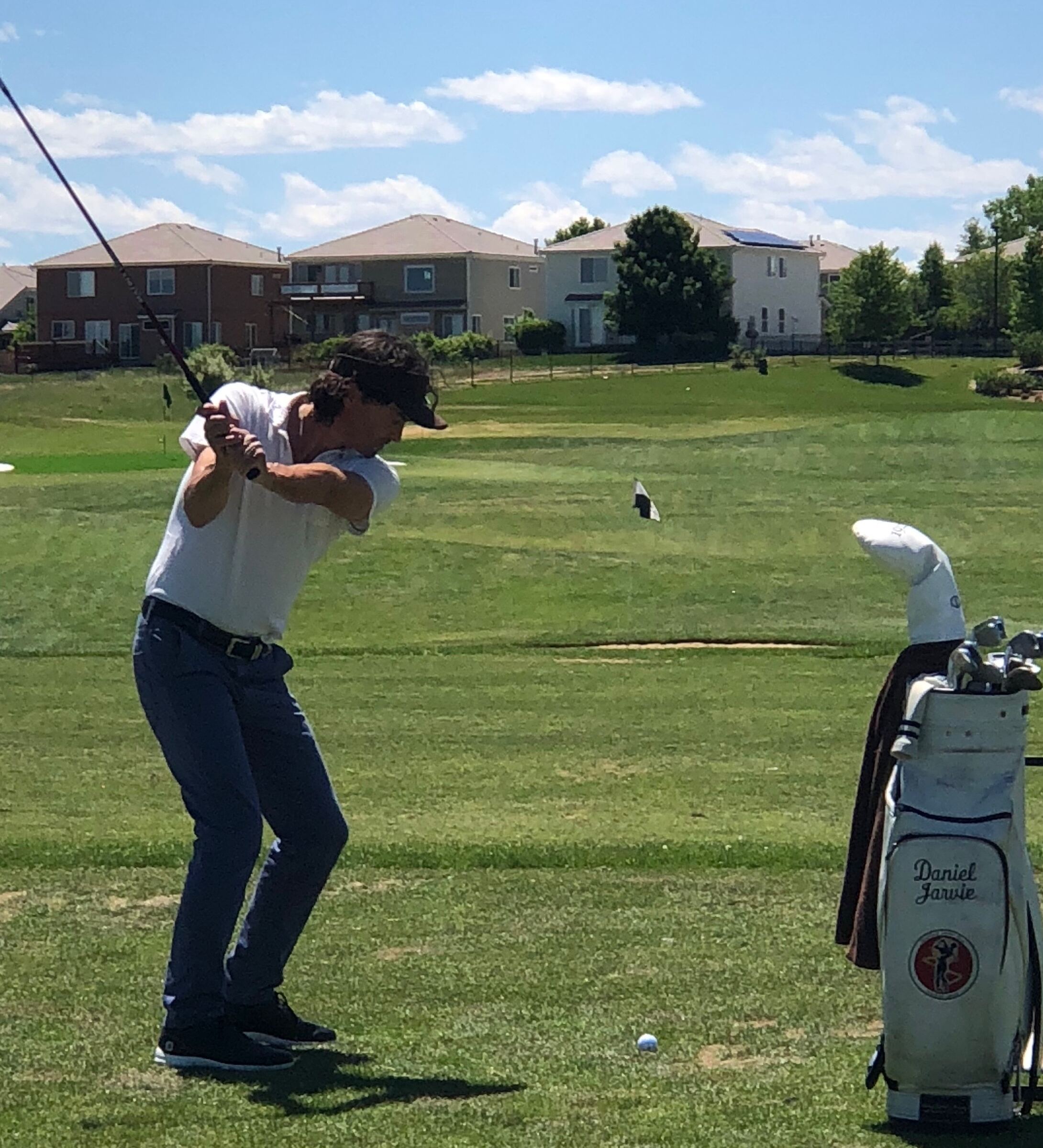Daniel Jarvie coaching a player on the course