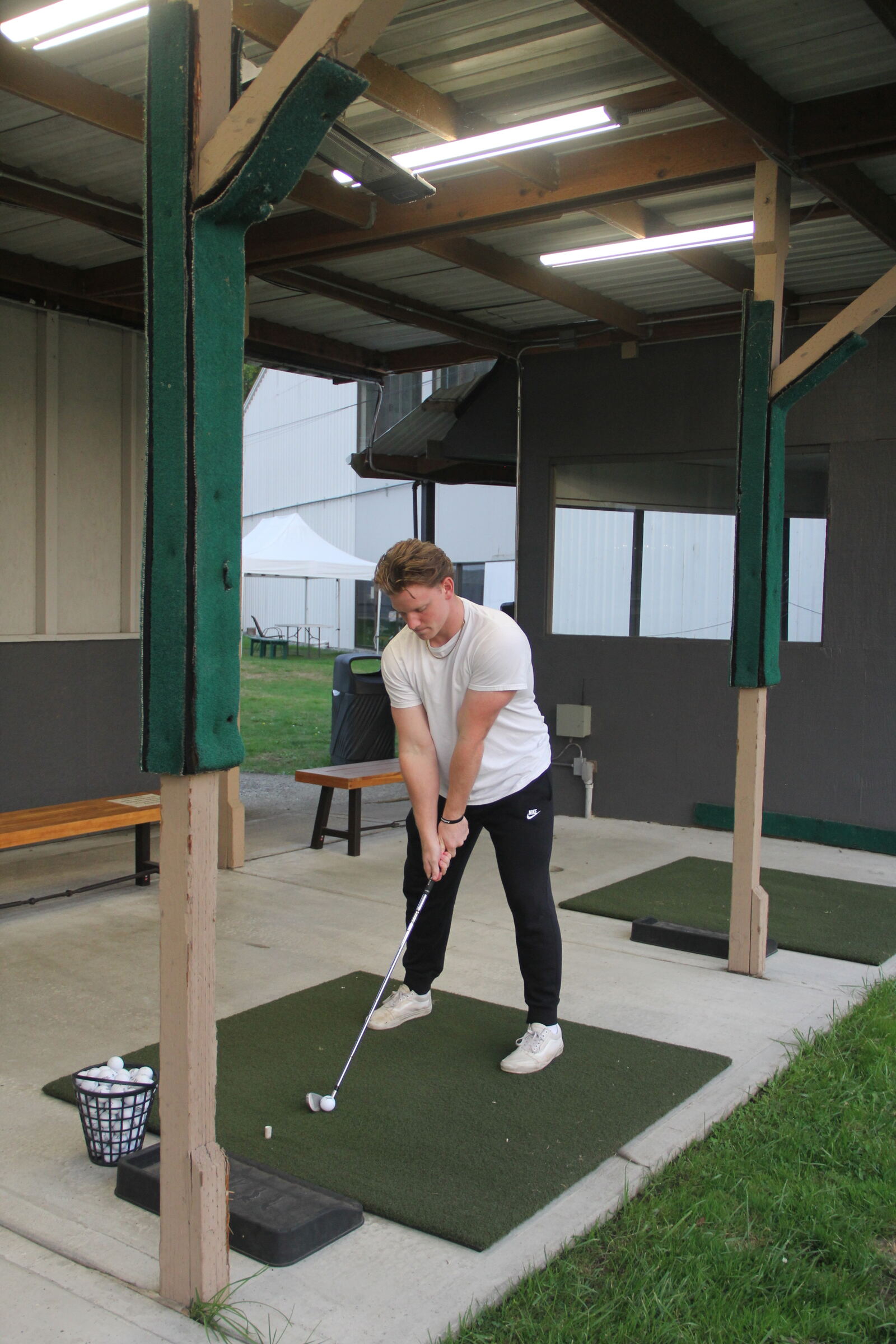 Golf player training on the range