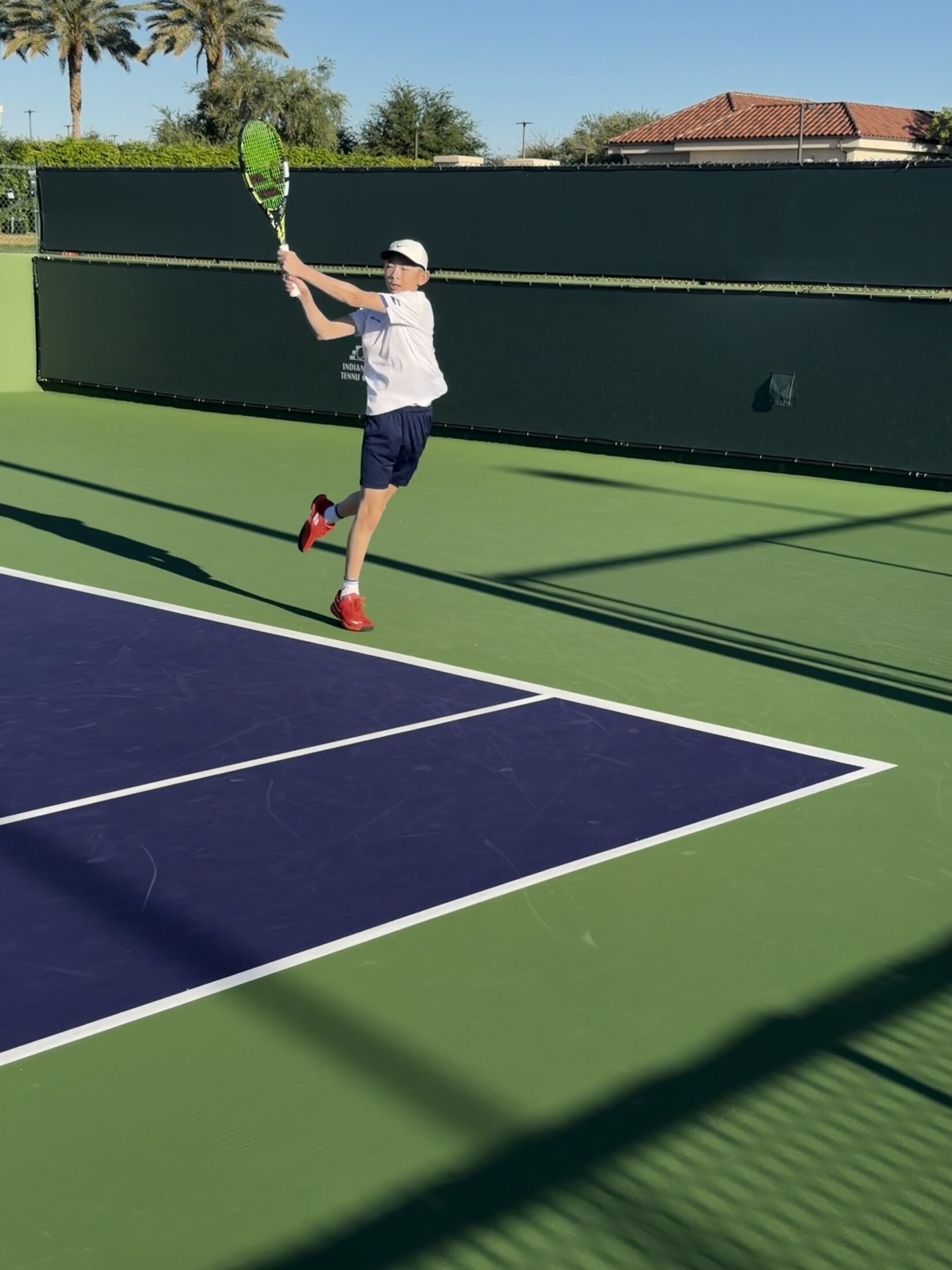Tier 1 tennis athlete competing outdoors