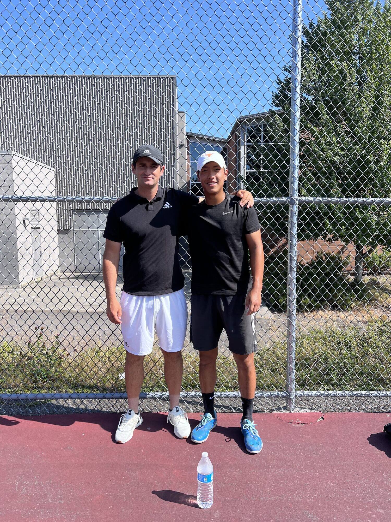 Tier 1 doubles finalists standing together after a tournament