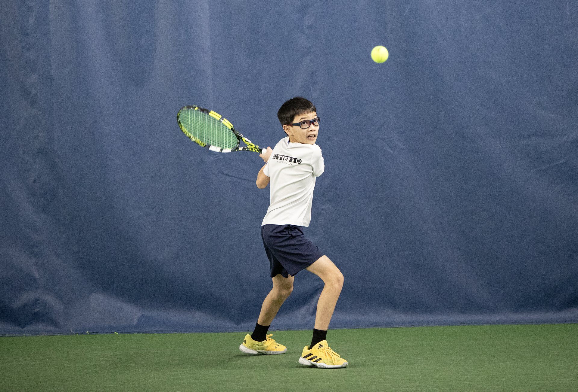 Tier 1 junior athlete striking indoors