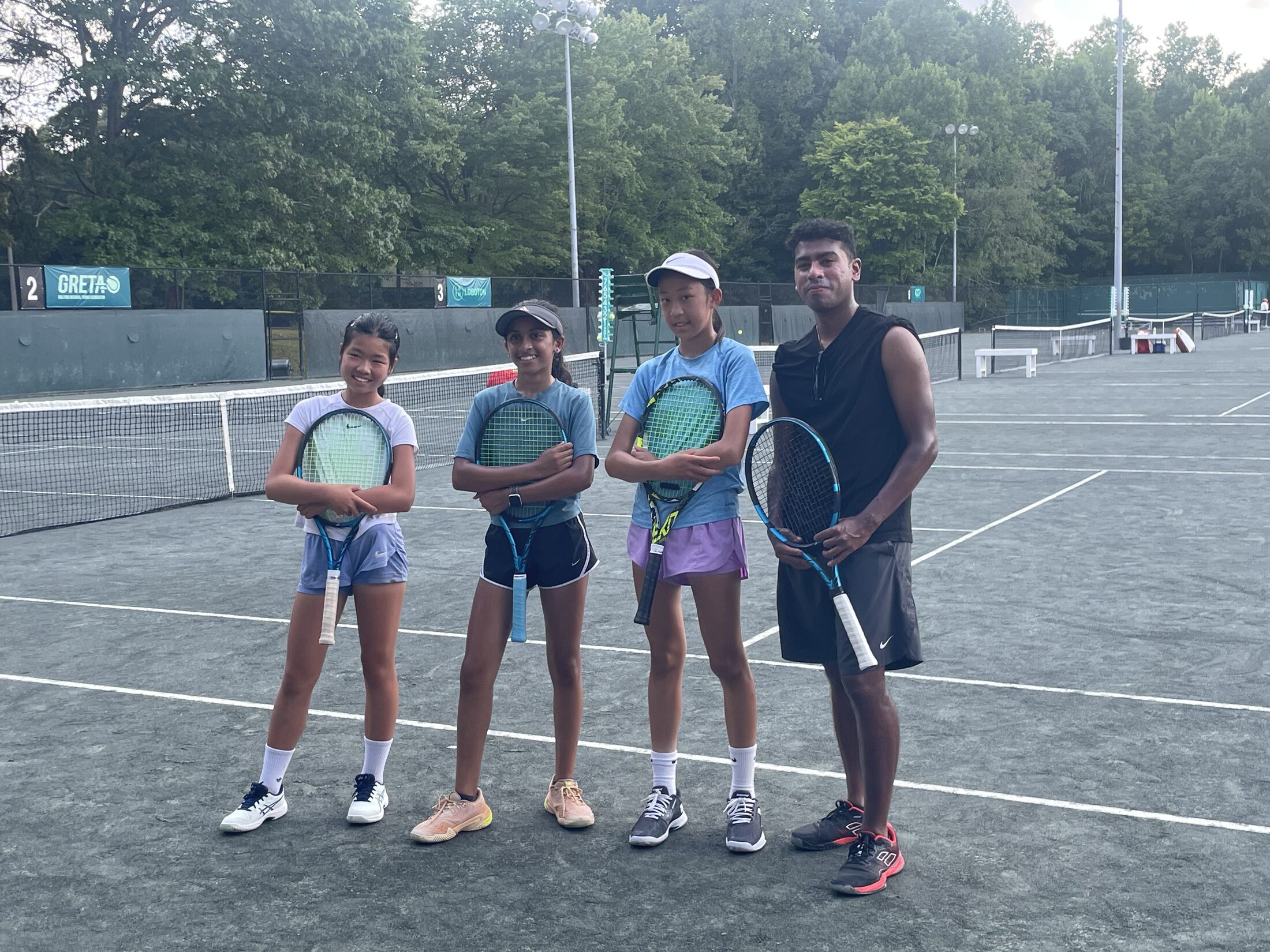 Tier 1 athletes and coach after an outdoor training block