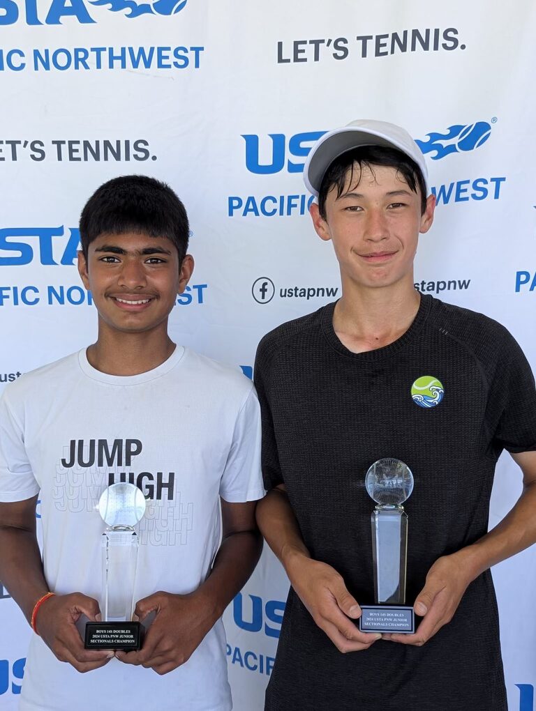 Two Tier 1 tennis players with trophies at a USTA event